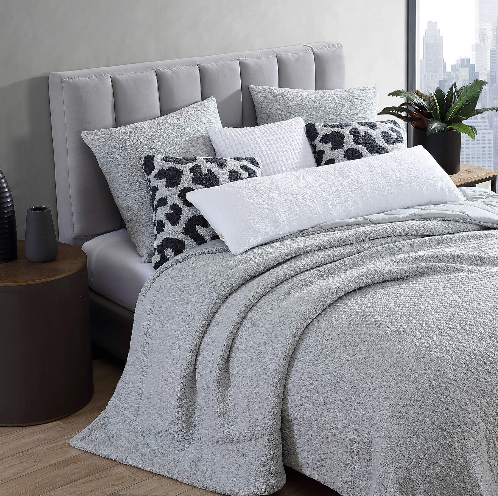 Grey comforter. Grey bedding and pillows. Fun neutral patterned pillows. Grey modern bedroom inspo.
