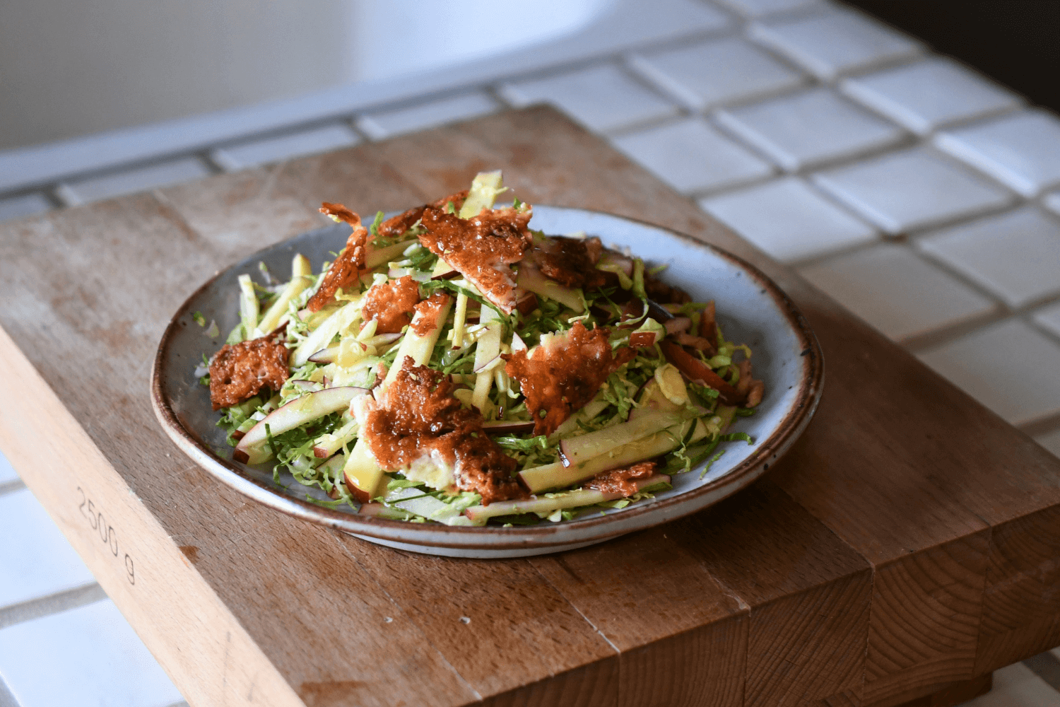 shaved brussel sprout salad on a plate
