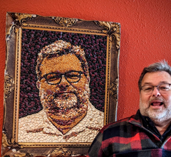 Steve Sando with a portrait made out of beans