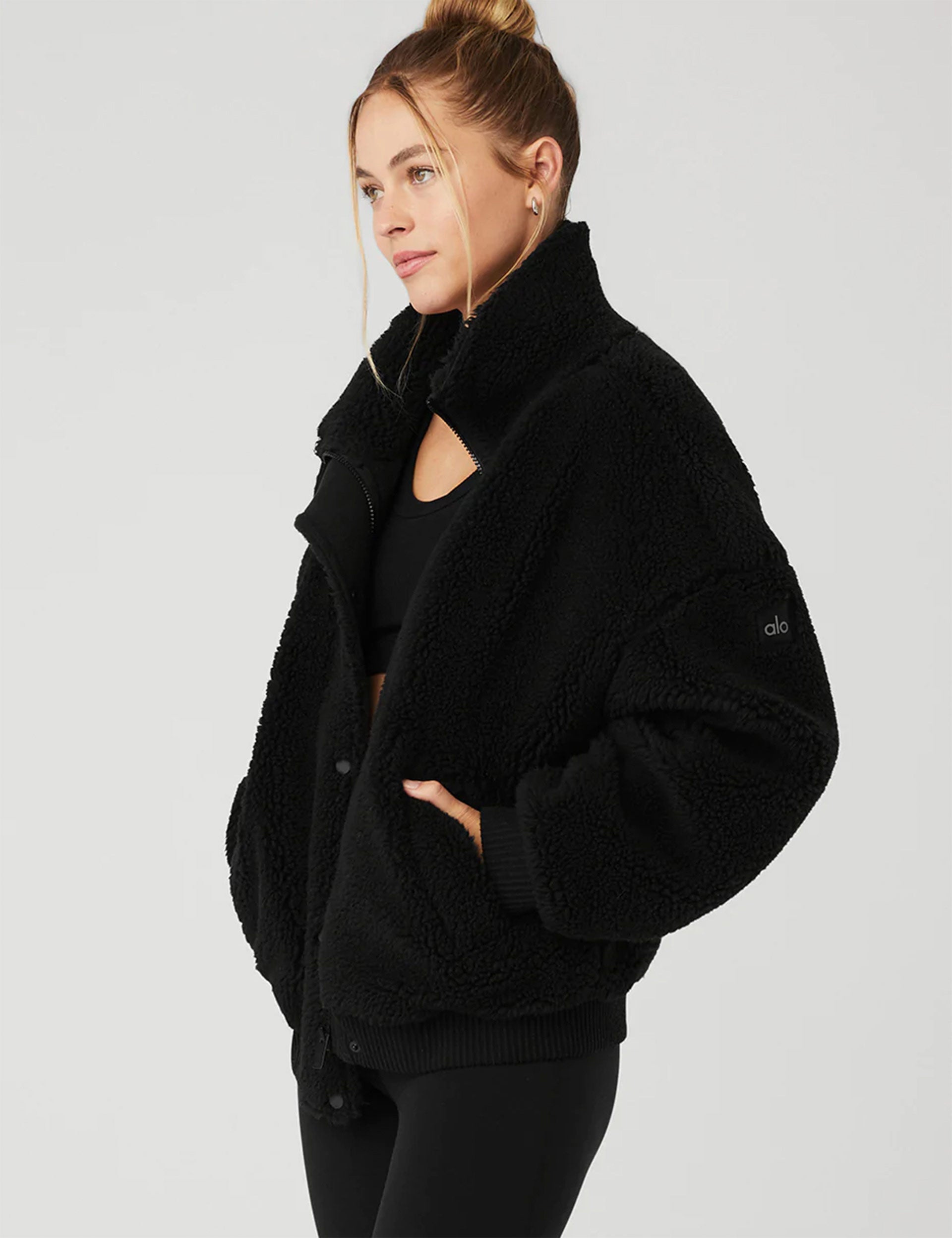 Alo Yoga | Sherpa Varsity Jacket - Black | The Sports Edit