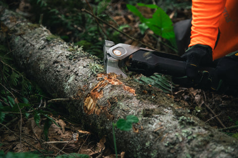 hatchet cutting through a log