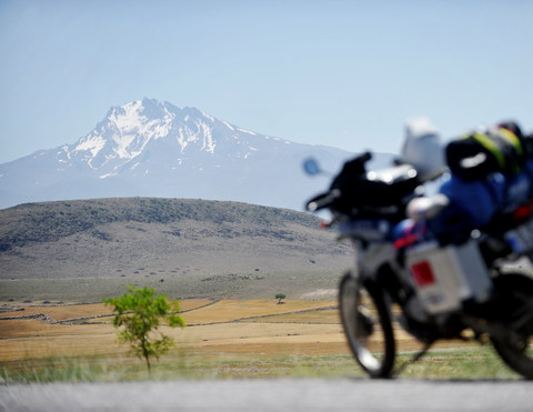 ADV motorcycle in a scenic landscape