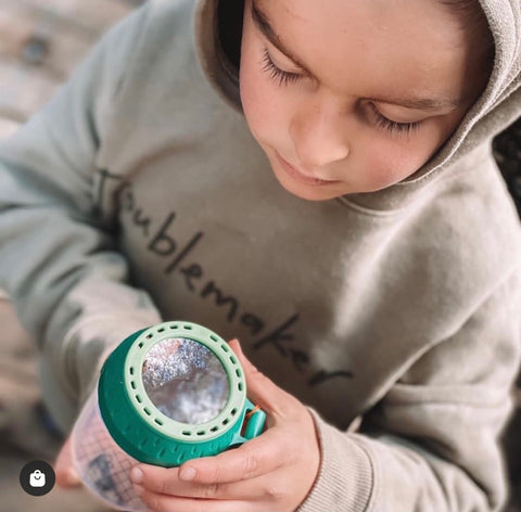 Boy looking at insect