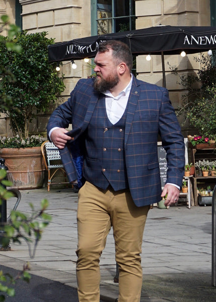 Co-founder Tony in smart casual outfit with navy suit jacket.