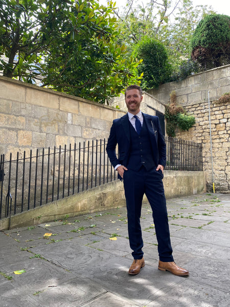 Model wears the full Caridi suit in Bath City Centre.