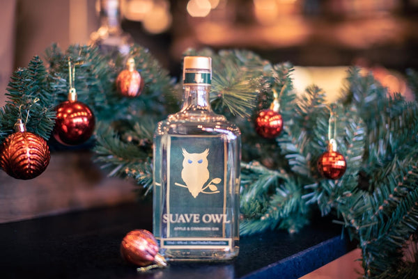SUAVE OWL Gin with Christmas decoration.