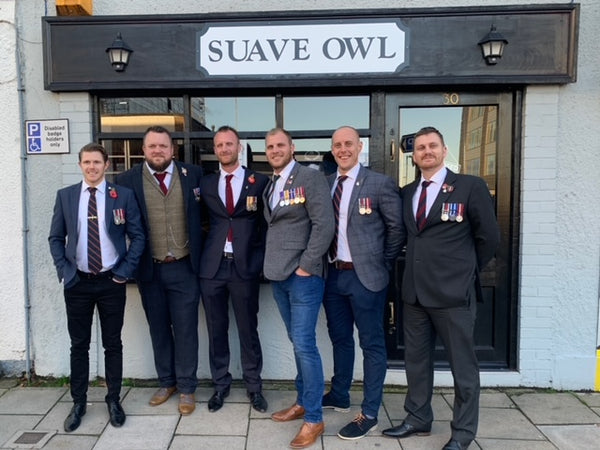 Tony outside Keynsham shop wearing medals with other ex-service personnel, also wearing medals.