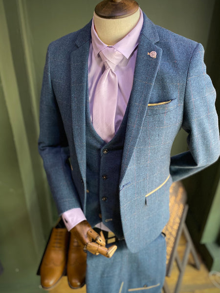 Dion suit on mannequin with lilac accessories and shirt.