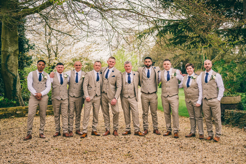 Large Groomsmen Party Stands Outside For Group Picture