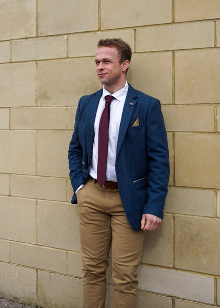 Smart casual outfit with suit jacket worn by model.