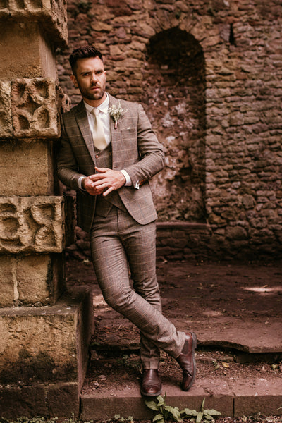 Model wears the Ted suit under cover outdoors.