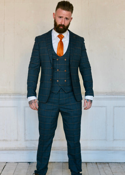 Jenson suit worn by model, styled with orange.