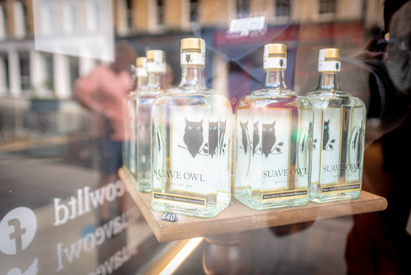 SUAVE OWL gin in shop window. 