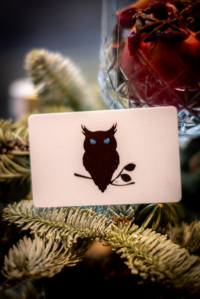 SUAVE OWL Gift Card sitting in Christmas tree.