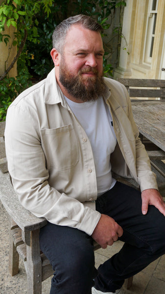 Tony wearing the corduroy overshirt in cream.