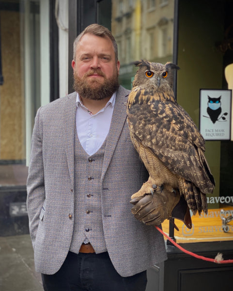 Tony with a Great Horned owl outside SUAVE OWL Bath.