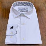 A folded SUAVE OWL white shirt.