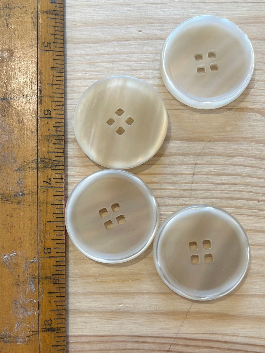 Mother of pearl 4 hole rimmed buttons