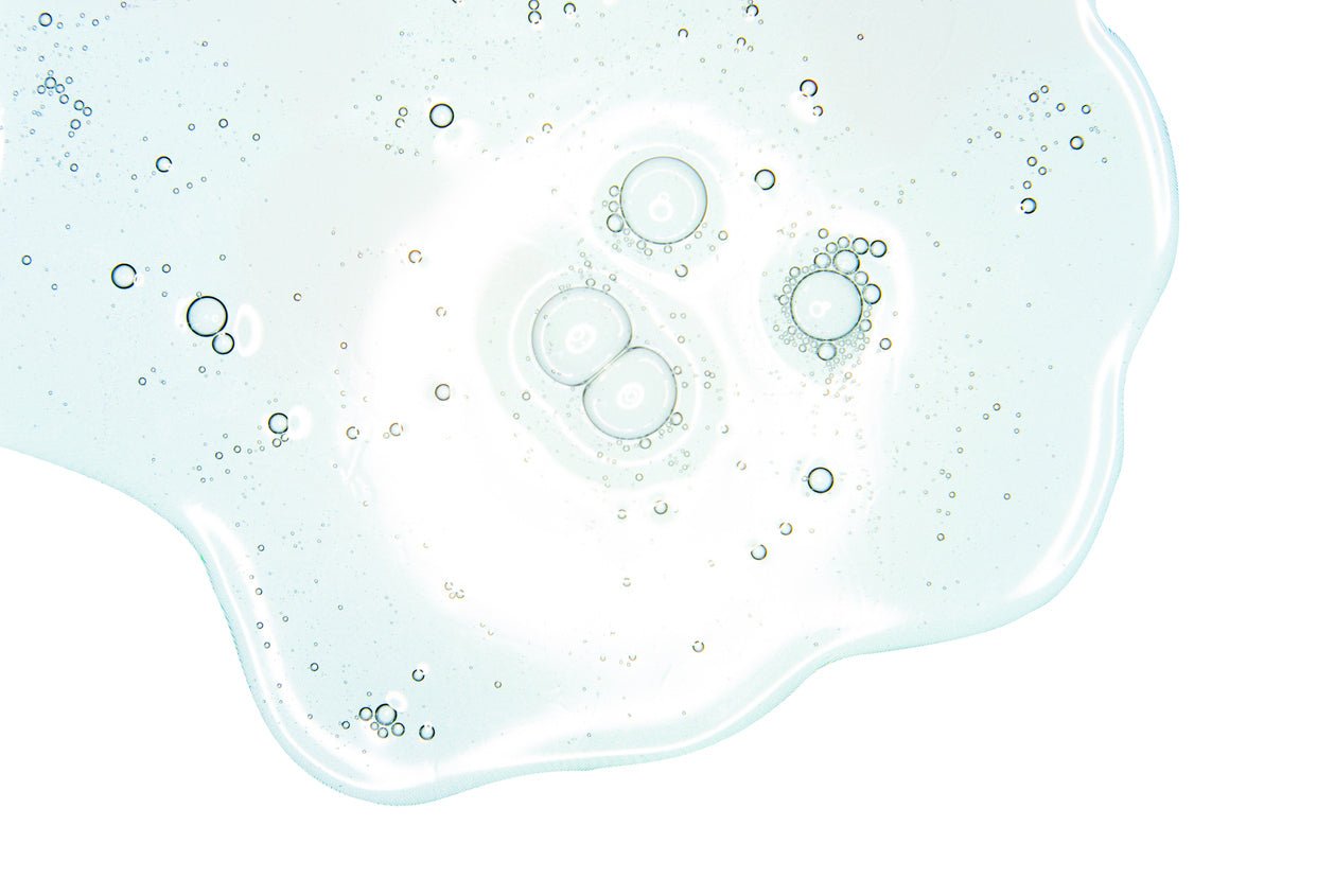 Image of clear, light blue liquid gel with bubbles.