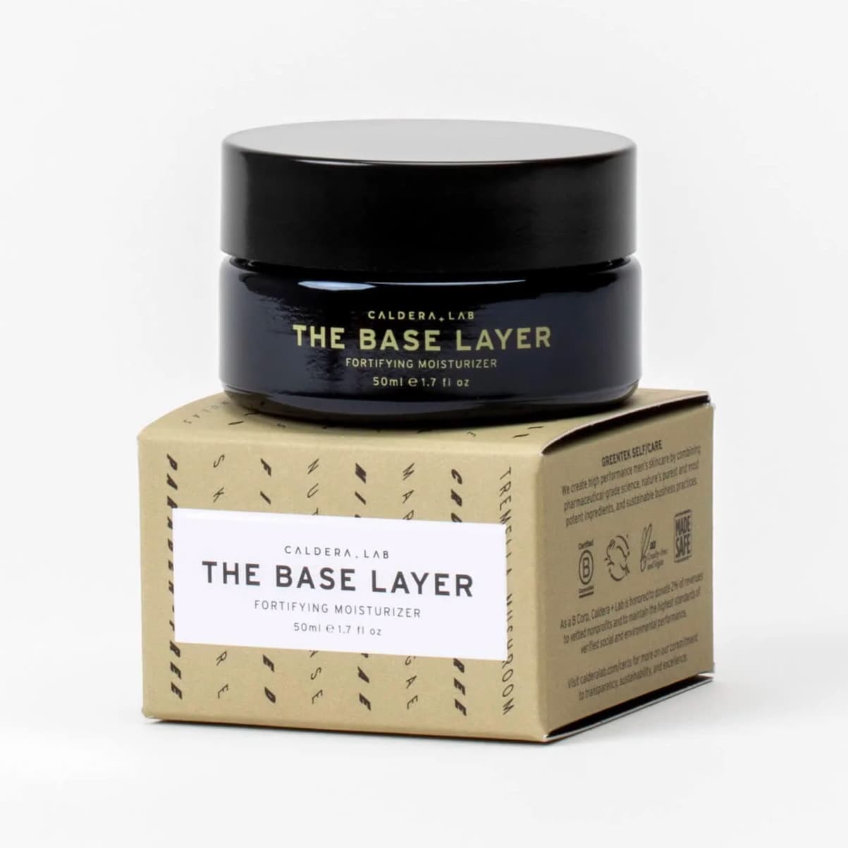 The Base Layer fortifying moisturizer with the glass jar sitting atop the outer beige packaging on a white background.