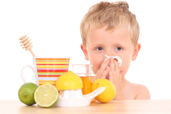 boy with colds blowing his nose, home remedies for colds