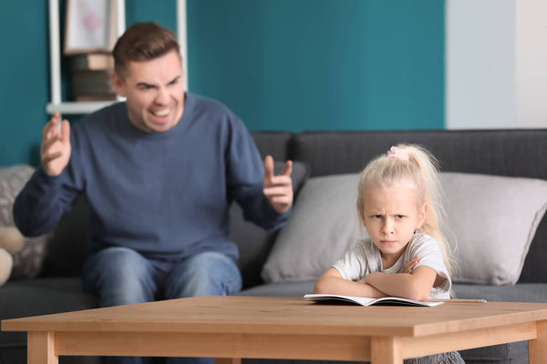 Father scolding an angry little daughter