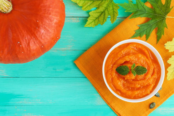 Organic pumpkin puree (soup) in a white bowl. Dietary dish. Baby food.