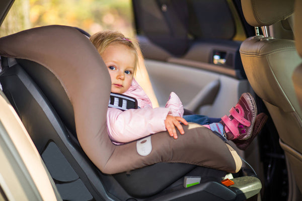 Infant baby girl in car seat