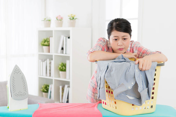housewife leaning on clothing basket