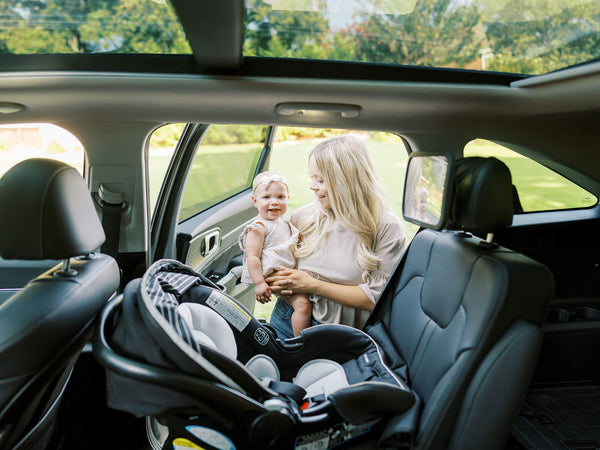 taking baby on a car for diaper change