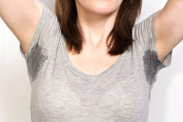 Woman sweating very badly under armpit