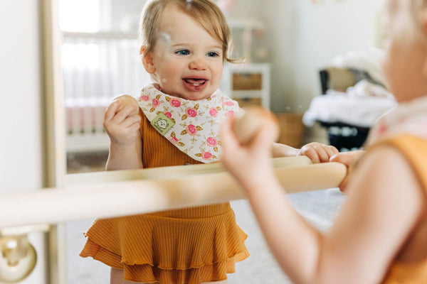 baby girl looking good in a dress and KeaBabies Bandana Bib