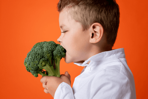 Toddler Eating Vegetable 
