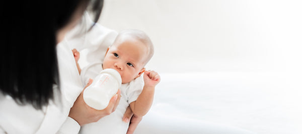 Mother Feeding Baby Bottle Milk 