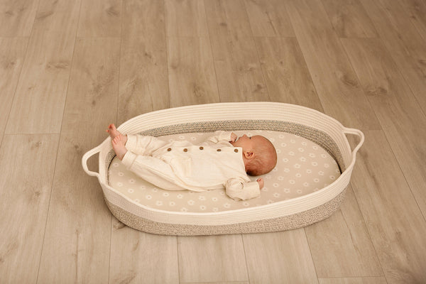 baby resting safely on a bassinet