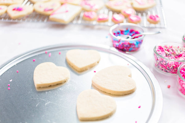 Decorating Heart Shape Sugar Cookies Royal Icing Pink Sprinkles Valentine