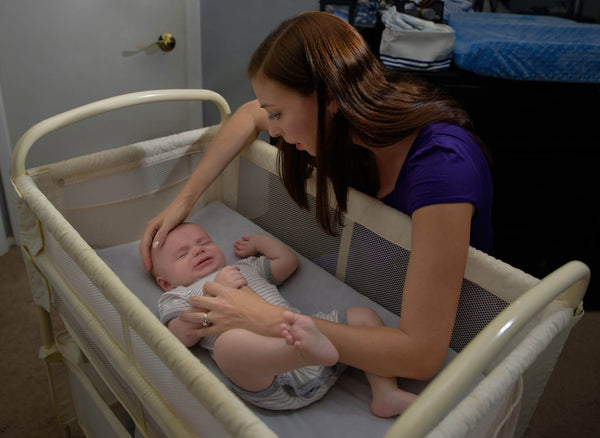 mother comforting a crying baby