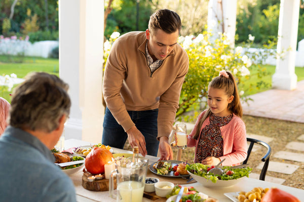 Multi Generation Caucasian Family Eating Outdoor Dinner
