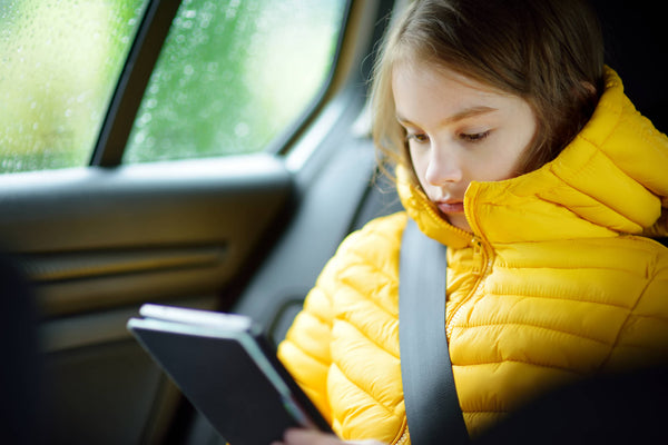 Adorable Girl Sitting Car Reading Her Ebook