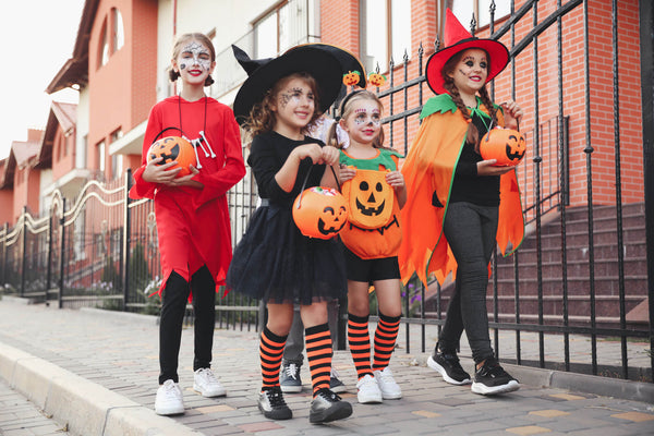 Cute Little Kids Wearing Halloween Costumes Going Trick Treating Outdoors