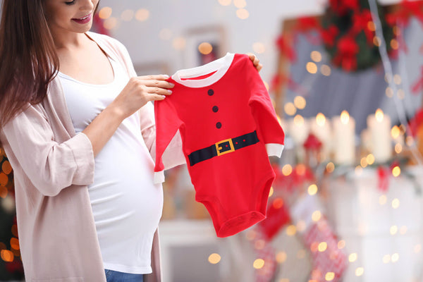 Woman with Santa Claus baby suit
