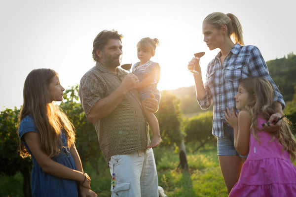 Family together in vineyard