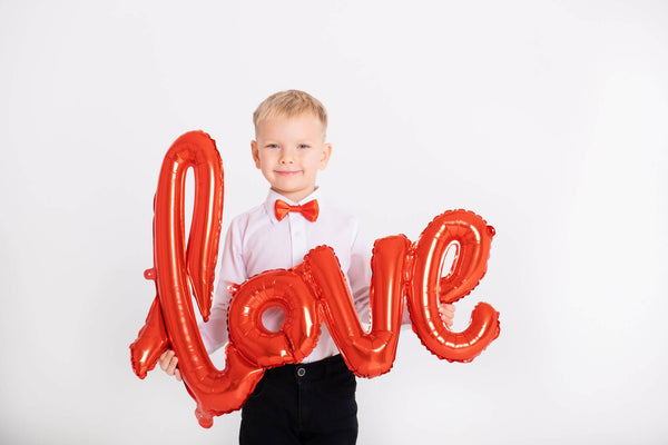 Boy Suit Red Bow Tie Holds Inscription Love Balloons