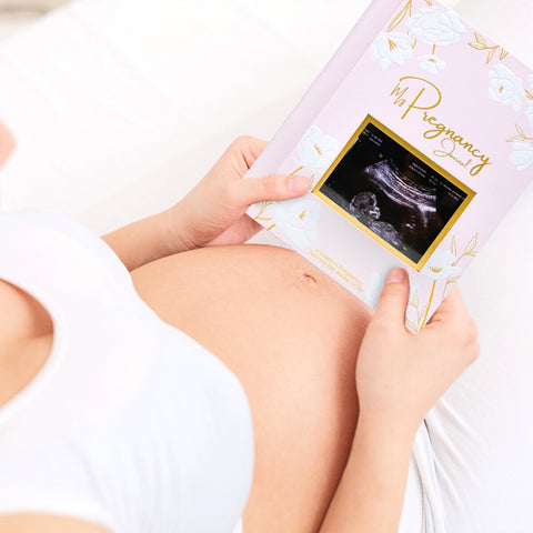 Use the front cover of the book with your favorite sonogram photo as a pregnancy announcement prop.
