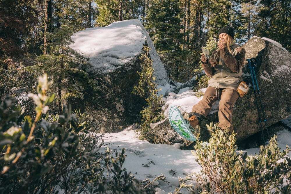 Snowshoer takes a break to enjoy a snack