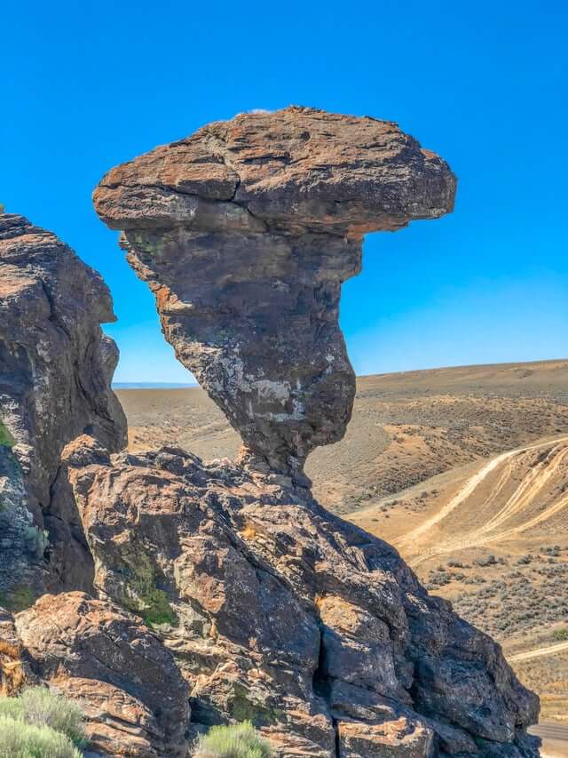 cool rock balanced on top of another rock