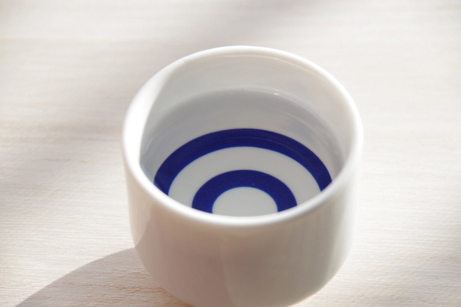 The “janome” (or “kikichoko”) is a porcelain or ceramic ochoko with a blue bullseye pattern