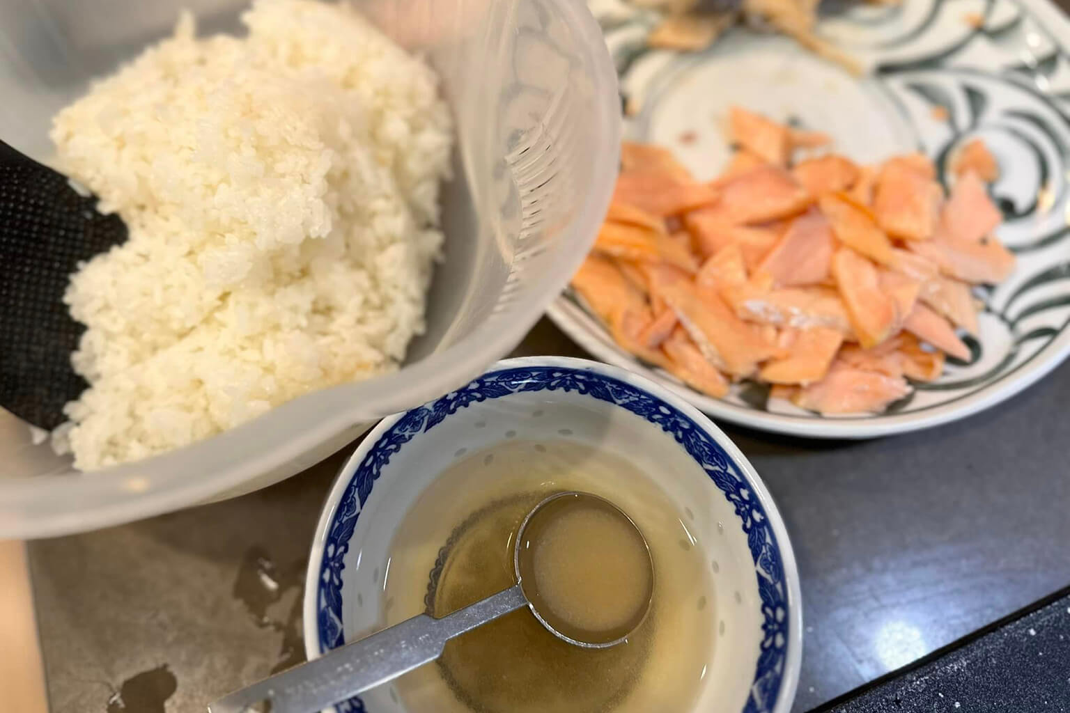 Prepare salmon, rice, and a mixture of sugar and vinegar.