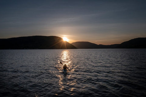 Chev Dixon kayaking at sunset