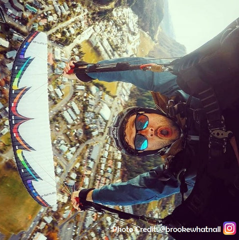 Vilo - Person Skydiving whilst wearing wooden sunglasses